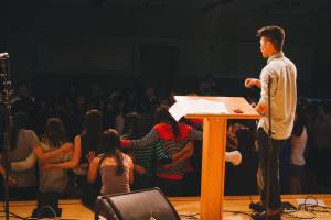 Annual prayer over each class at the first Large Group, Aug. 2014. PC: Wheaton Koinonia